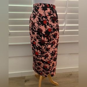 ANTHROPOLOGIE Exquise skirt with flowers detail.